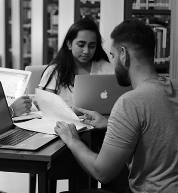 Students preparing together with laptops and notes